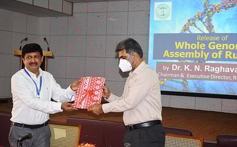 Rubber Board executive director Dr. K N Raghavan releasing the whole genome sequence of Indian hybrid rubber clone by receiving the first copy from RII director Dr. James Jacob in Kottayam | EPS