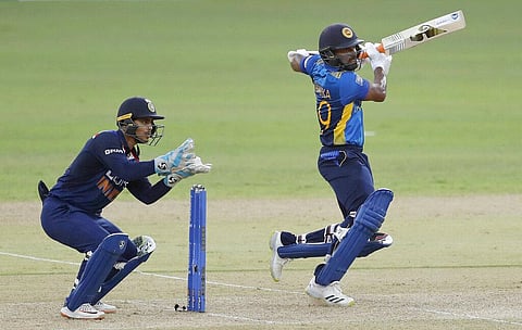 Sri Lanka's Chamika Karunaratne plays a shot as India's wicketkeeper Ishan Kishan watches during the first one day international cricket match (Photo | AP)