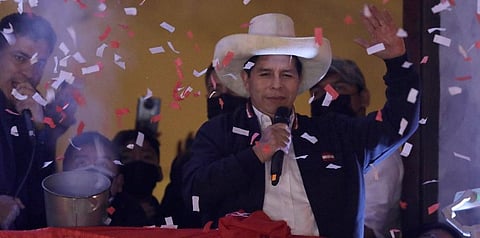 Pedro Castillo waves to supporters after election authorities declared him president-elect during celebrations at his party's campaign headquarters in Lima, Peru, Monday, July 19, 2021. (Photo | AP)