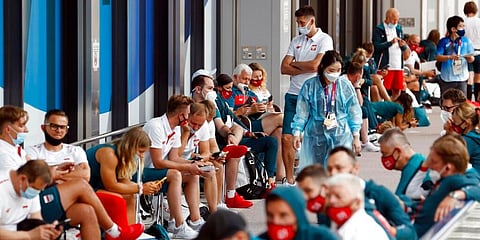 Poland's team wait for medial test related to COVID-19 on their arrival for Tokyo 2020 Olympics at Narita international airport in Narita, east of Tokyo, Sunday, July 18, 2021. (Photo | AP)