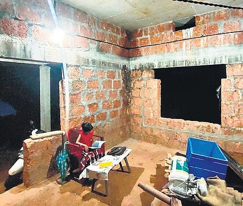 The student of Keezhal UP school engaged in her studies.