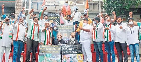 Congress workers protest against the Union Government amid the snoopgate row in Bengaluru on Wednesday