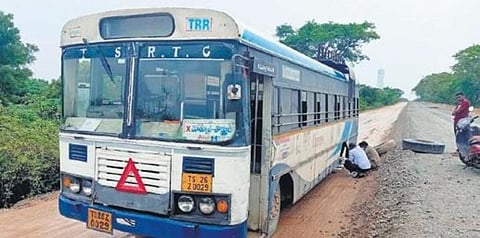 The TSRTC bus that was left stranded after two rear tyres fell off the wheel hubs near Katepally in Yadadri Bhongir district on Wednesday. (Photo | Express)