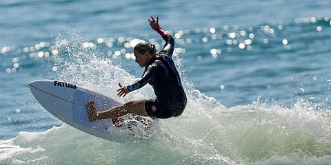 Yolanda Sequeira, of Portugal, rides a wave during a surf training session at the 2020 Summer Olympics at Tsurigasaki beach in Ichinomiya. (Photo | AP)