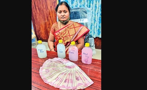 Kataram MRO M Sunitha with the money with which she was caught red-handed by ACB officials, in Jayashankar Bhupalpally district on Thursday