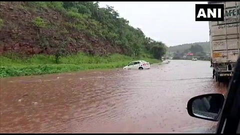 Road near NH-4 in Belgaum's Bhutramatti waterlogged due to heavy rainfall. (Photo | Twitter/ANI)