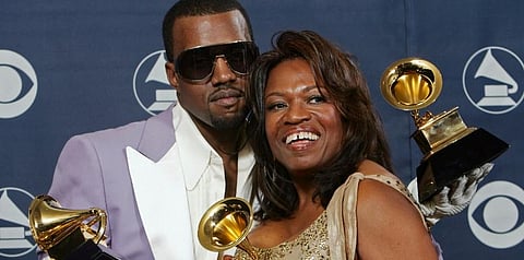 In this Feb. 8, 2006, file photo, Kanye West and his mother, Donda, hold his three awards backstage at the 48th Annual Grammy Awards in Los Angeles. (File photo | AP)