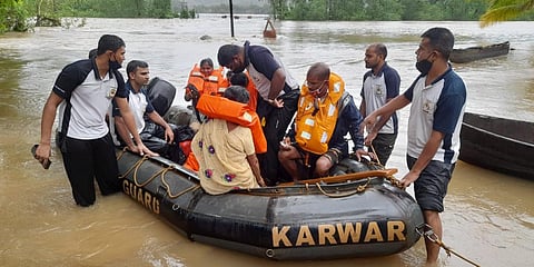 Coast Guard officials carry on their rescue work at rain-hit Karwar district of Karnataka. (Photo| EPS)