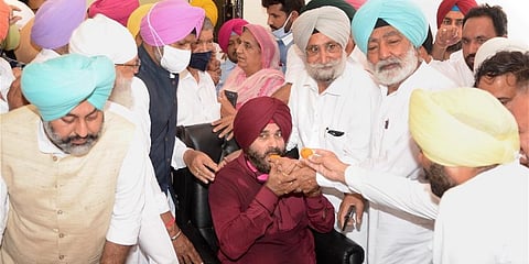 Newly appointed Punjab Congress President Navjot Singh Sidhu being congratulated by supporters at Punjab Congress Bhawan in Chandigarh. (Photo | PTI)