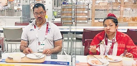 Weightlifting coach Vijay Sharma and Mirabai Chanu at the Games Village in Tokyo on Friday. (Photo Courtesy | SAI)