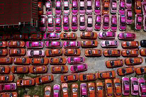 This aerial photo taken on July 20, 2021 shows scores of taxis left in a parking lot, after drivers were unable to pay rent on them due to the economic hardship of Covid-19. (Photo | AFP)
