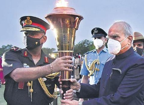 Guv Purohit receiving the Flame from Lt. General A Arun | P JAWAHAR