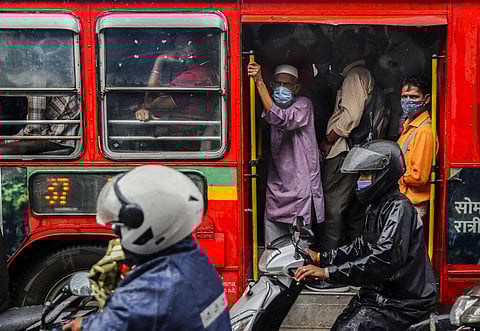 People wearing masks as a precaution against the coronavirus travel in a bus in Mumbai, India, Tuesday, July 13, 2021. (Photo | AP)