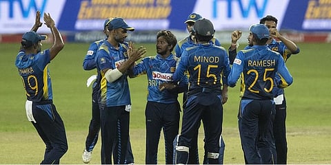 Sri Lanka's Akila Dananjaya, center, celebrates the dismissal of India's Nitish Rana with teammates in the 3rd ODI. (Photo | AP)