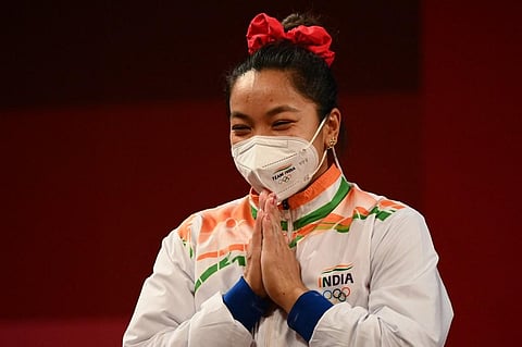 Silver medallist India's Chanu Saikhom Mirabai during the victory ceremony of women's 49kg weightlifting competition during Tokyo Olympic 2020 on July 24, 2021. (Photo | AFP)