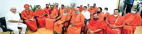 Chief Minister BS Yediyurappa with seers of various mutts in Bengaluru recently