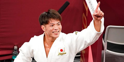 Hifumi Abe, of Japan, celebrates after defeating Vazha Margvelashvili, of Georgia, in the men's - 66kg gold medal judo match at the Tokyo 2020 Olympics in Tokyo. (Photo | AP)