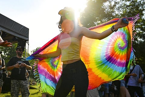A woman dances during a gay pride parade in Budapest, Hungary. 