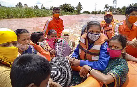 NDRF team during a rescue operation at a flooded area after rain in Kolhapur. (Photo | PTI)
