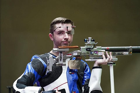William Shaner, of the United States, reacts after the men's 10-meter air rifle at the Asaka Shooting Range in the 2020 Summer Olympics. (Photo | AP)