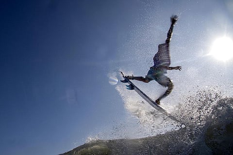 Brazil's Italo Ferreira rides a wave during the first round of the men's surfing competition at the 2020 Summer Olympics. (Photo | AP)