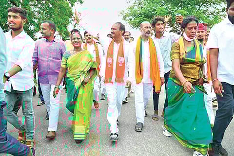 BJP State president Bandi Sanjay Kumar takes out a rally alongside former Minister Eatala Rajender at Illandakunta mandal in Karimnagar on Saturday
