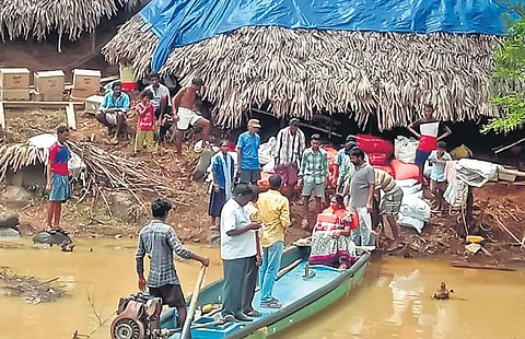 relief works  underway at a West Godavari village submerged in the floodwater I Express