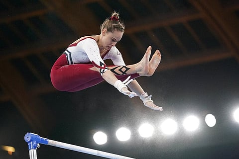 Sarah Voss, of Germany, performs on the uneven bars during the women's artistic gymnastic qualifications at the 2020 Summer Olympics. (Photo | AP)