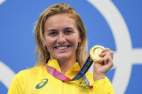 Ariarne Titmus, of Australia holds up her medal after winning the final of the women's 400-meters freestyle at the 2020 Summer Olympics. (Photo | AP)