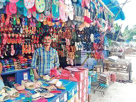 A street vendor selling footwear near Padhiary Pathagar in Cuttack | Express