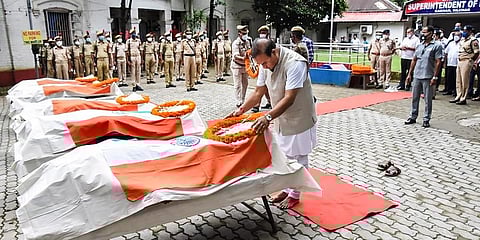 Assam Chief Minister Himanta Biswa Sarmah pays homage to the 6 Assam Police personnel who died in Monday's clashes at Lailapur on the Assam-Mizoram border, in Silchar. (Photo | PTI)