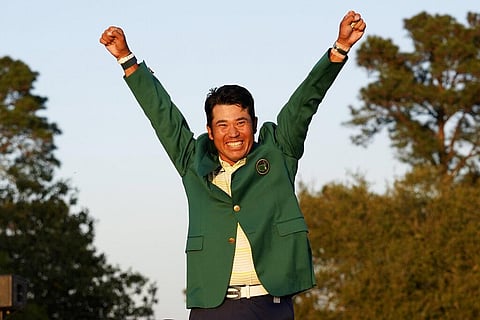 In this April 11, 2021, file photo, Hideki Matsuyama, of Japan, celebrates after putting on the champion's green jacket. (Photo | AP)
