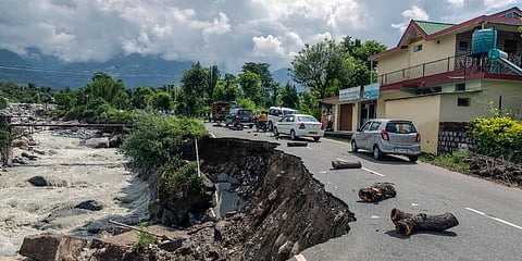 A damaged road due to flash flood after heavy rain at Sheela village near Dharamshala. (File Photo | PTI)