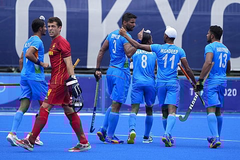 India's Rupinder Pal Singh (3) celebrates after scoring against Spain during a Men's field hockey match at the 2020 Summer Olympics. (Photo | AP)