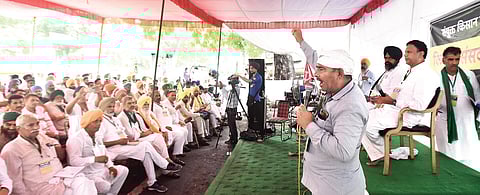 Farmers listen in rapt attention to a Kisan Sansad invitee at a session on agriculture laws at Jantar Mantar in New Delhi on Tuesday | Parveen negi