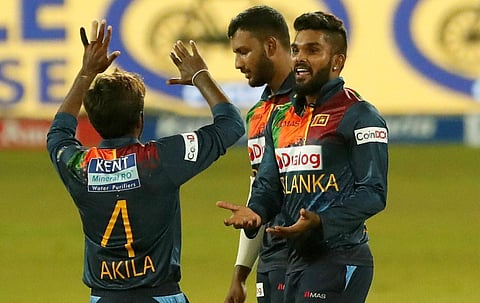 Sri Lanka's Wanindu Hasaranga, right, celebrates taking the wicket during second T20 match against India in Colombo, Sri Lanka, Wednesday, July 28, 2021. (Photo | PTI)