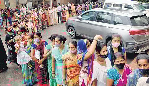 Beneficiaries wait to receive Covid vaccine in Noida on Wednesday | PTI