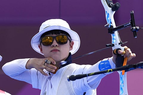 South Korea's An San shoots an arrow during the women's team competition at the 2020 Summer Olympics. (Photo | AP)