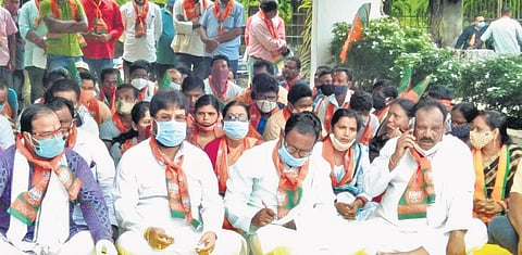 BJP workers on dharna in front of SIP’s Chief Engineer office at Laxmiposi. (Photo | Express)