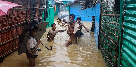 Rohingya refugee children play in flood waters at the Rohingya refugee camp in Kutupalong, Bangladesh, Wednesday, July 28, 2021. (Photo | AP)