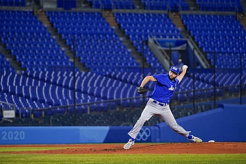 Israel pitcher Jake Fishman throws during a baseball game against South Korea at the 2020 Summer Olympics. (Photo | AP)
