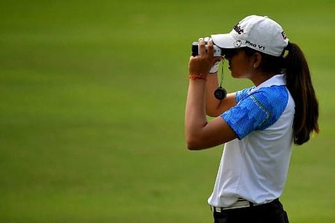 Diksha Dagar of India lines up a shot during round one of the women's individual golf event at the 2018 Asian Games in Jakarta on August 23, 2018. (Photo | AFP)