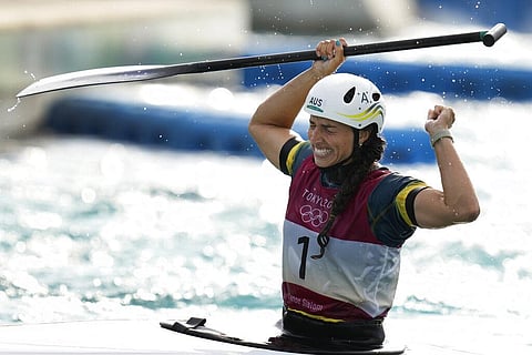 Jessica Fox of Australia celebrates as she crosses the finish line to win gold in the Women's C1 of the Canoe Slalom at the 2020 Summer Olympics. (Photo | AP)