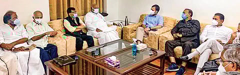 Leader of Opposition in the Rajya Sabha, Mallikarjun Kharge (fourth from left), chairs a meeting with the representatives of 14 Opposition party leaders at his chamber in Parliament on Wednesday. Cong