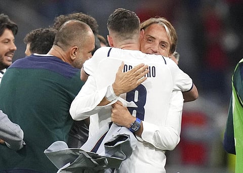 Italy's manager Roberto Mancini, right, and Italy's Giorgio Chiellini celebrate winning the Euro 2020 soccer championship quarterfinal match between Belgium and Italy. (Photo | AP)