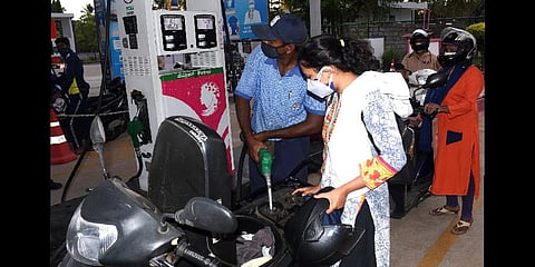 A volunteer getting free petrol from the pump. (Photo | Udayshankar S)