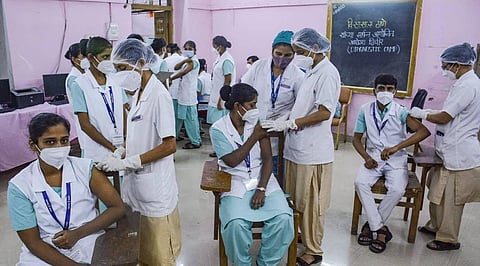 Nurses receive COVID-19 vaccine dose, at a nursing training college in Thane, Friday, July 30, 2021 (Photo | PTI)
