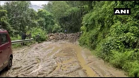 Multiple landslides on NH-10 on the West Bengal side between Rangpo and Melli blocked movement of traffic, cutting off the Sikkim border, officials said. (Photo | ANI)