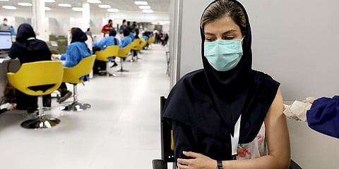 medical worker receives the Sinopharm coronavirus vaccine at the Iran Mall shopping center in Tehran, Iran. (Photo | AP)