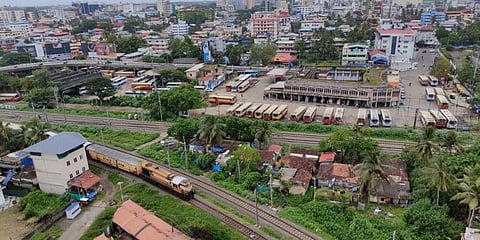 An aerial view of the Ernakulam KSRTC bus station. A train is seen chugging through the railway line close to the bus stand (Photo | A Sanesh, EPS)